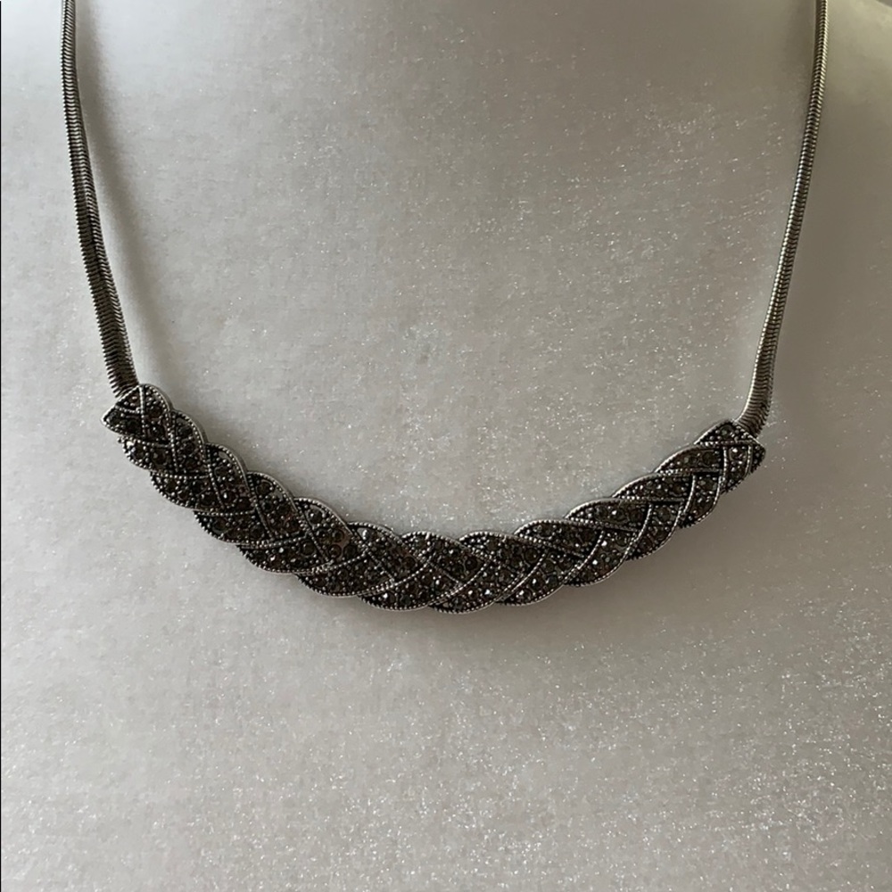 Silver necklace with braided design